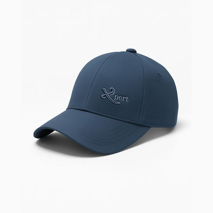 Side view of women’s blue Expert baseball cap with curved brim and minimal logo design