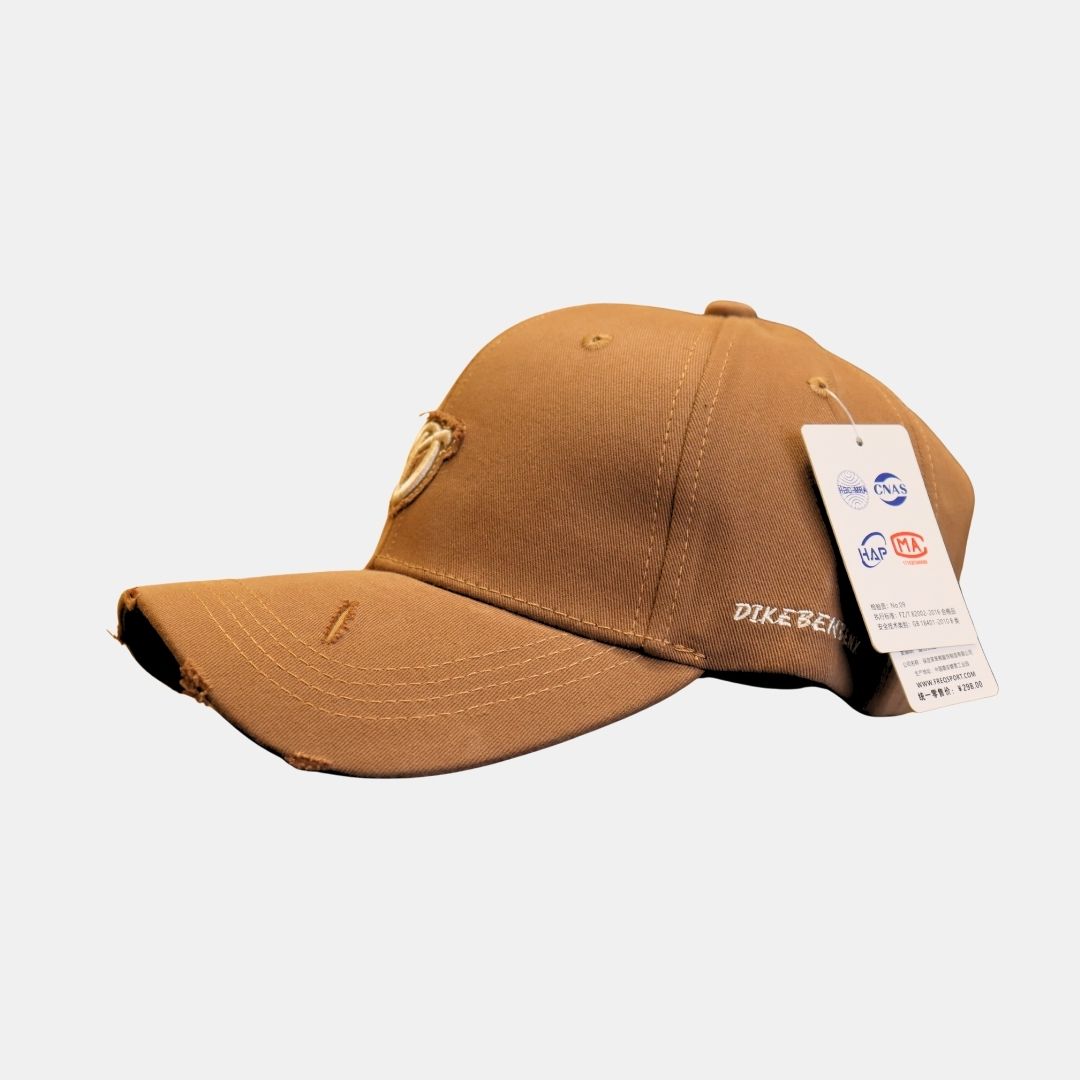 Side view of brown D embroidered baseball cap