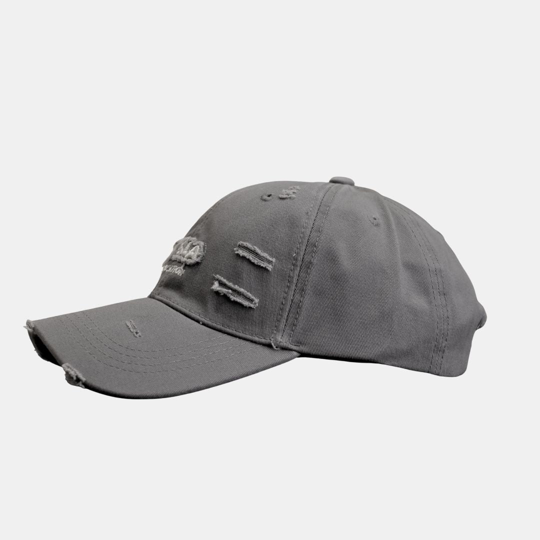 Side view of grey distressed baseball cap with embroidery