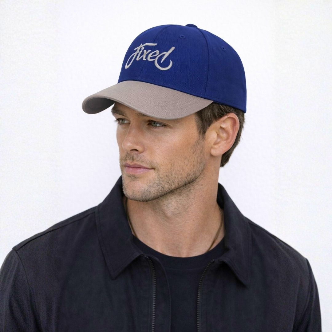 Men’s royal script two-tone baseball cap front view with fixed embroidery logo and curved brim