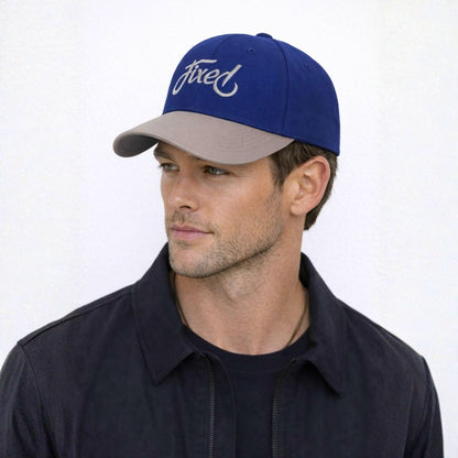 Men’s royal script two-tone baseball cap front view with fixed embroidery logo and curved brim