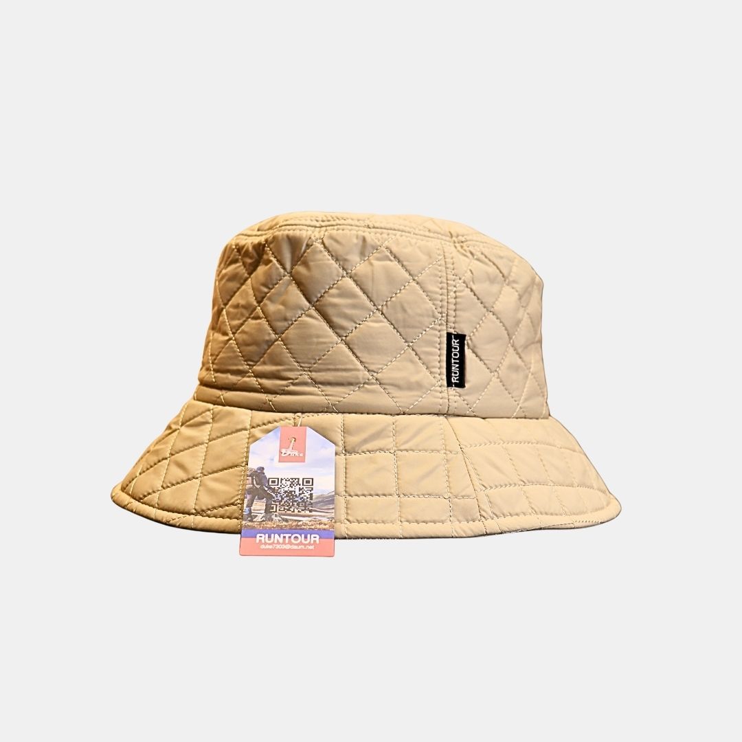 Side view of women’s beige quilted bucket hat stylish textured design
