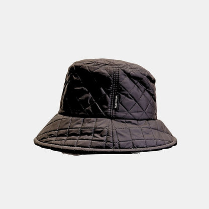 Side view of women’s black quilted bucket hat modern textured design